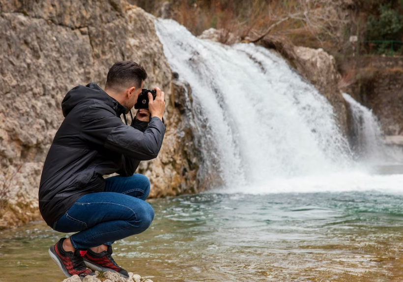 A scenic landscape showcasing a vibrant sunset over a tranquil lake, surrounded by lush green mountains, ideal for photography enthusiasts.