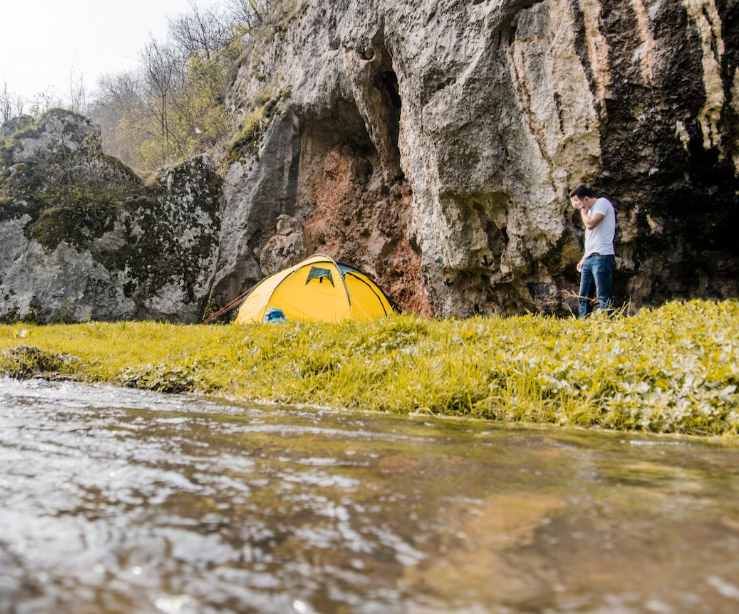 A scenic view of Poudre River Campground, featuring lush greenery and peaceful water surroundings, ideal for camping and outdoor activities.